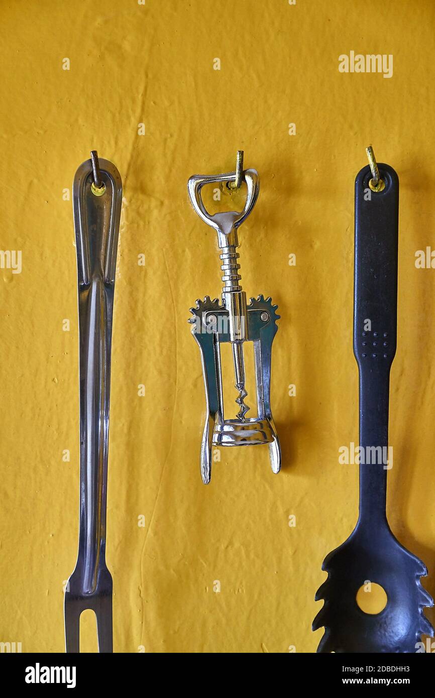 Bottle opener for beer and wine hanging on a kitchen wall Stock Photo Alamy