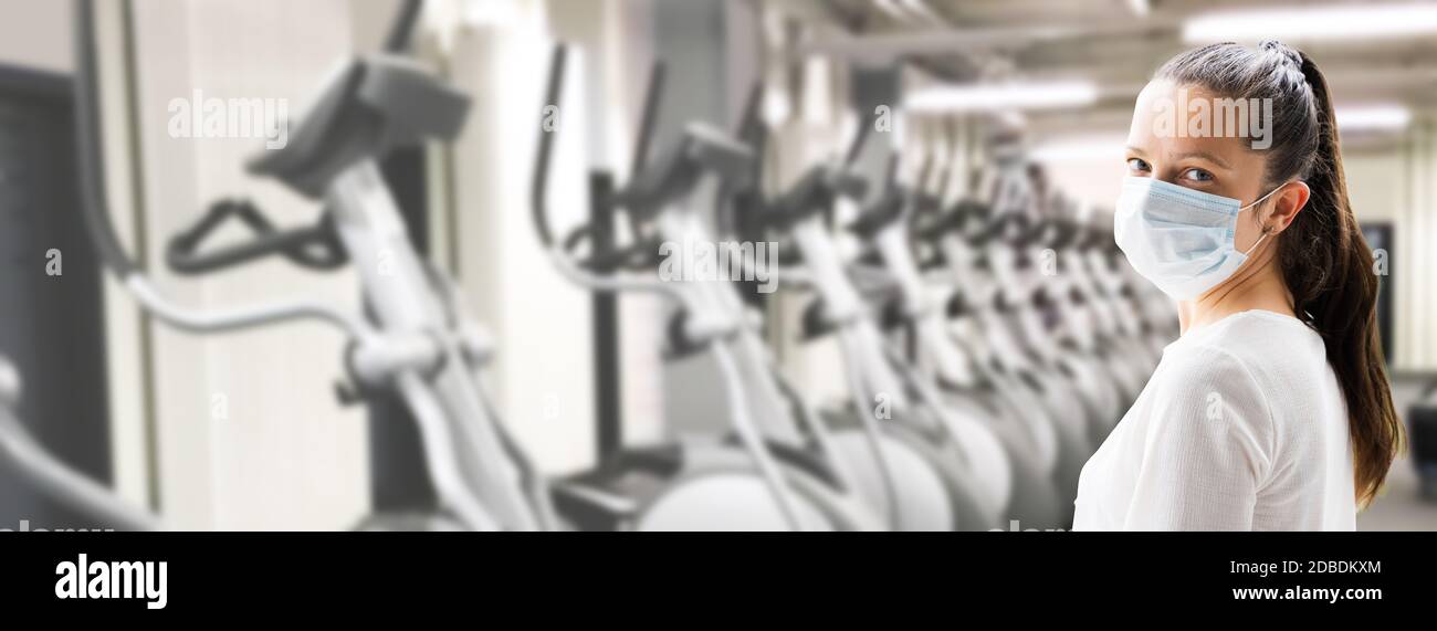 Slim Woman Exercising In Gym Wearing Face Mask Stock Photo Alamy
