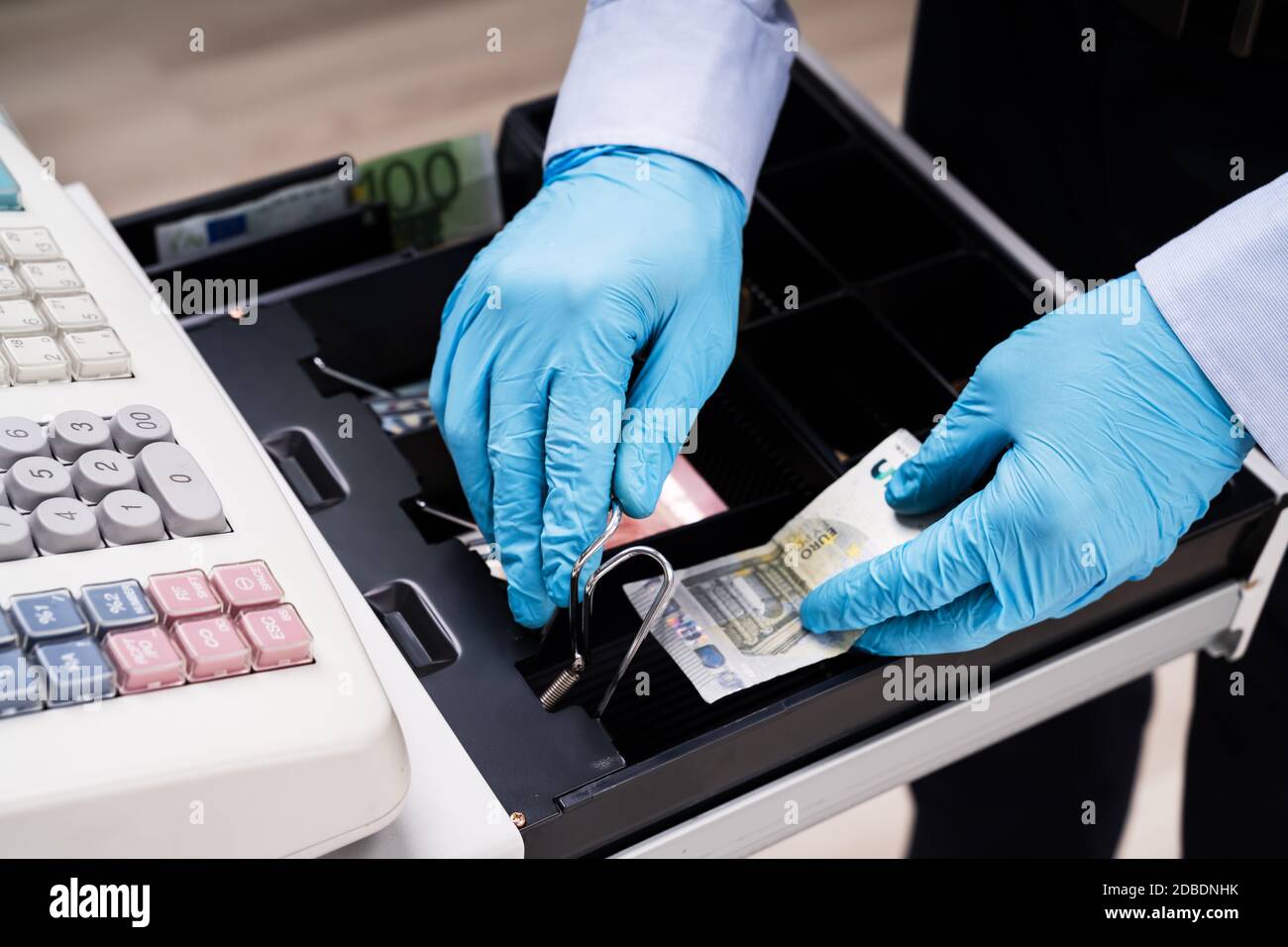 Cashier Working With Register Cash Holding Money In Hand Stock Photo Alamy