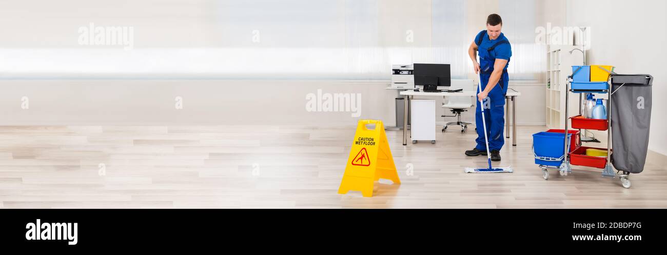 Professional Floor Cleaning Service. Janitor Mopping Office Stock Photo