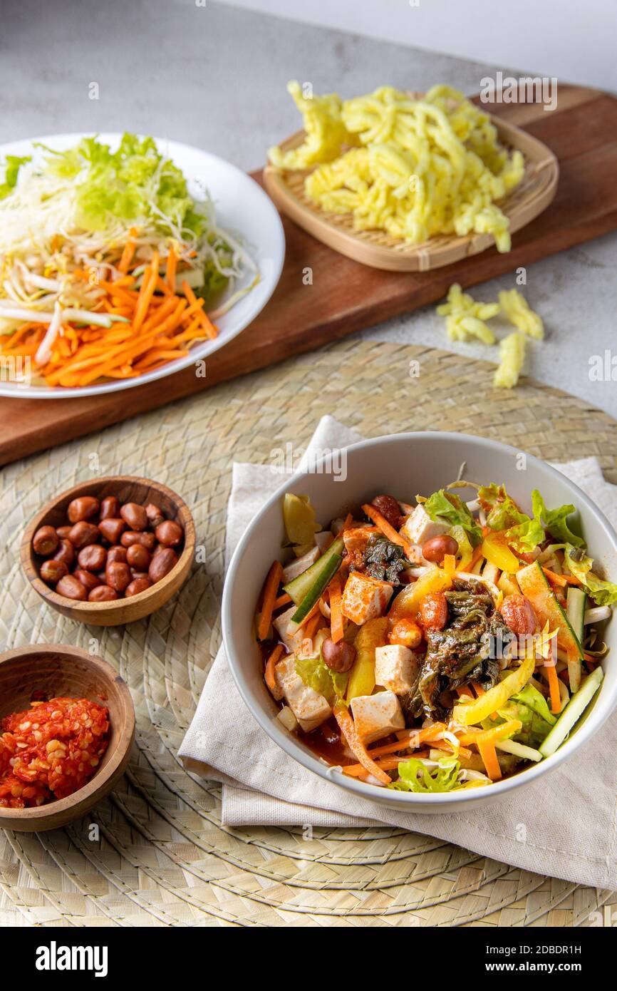 Asinan Bogor. Indonesia traditional salad from Bogor West Java. Tropical fruits pickled in a sweet, spicy, sour, and salty brine. Javanese Indonesian Stock Photo