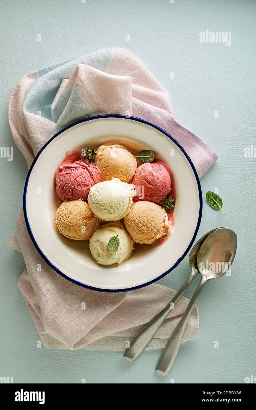 Set of ice cream scoops or frozen yogurt of different colours and