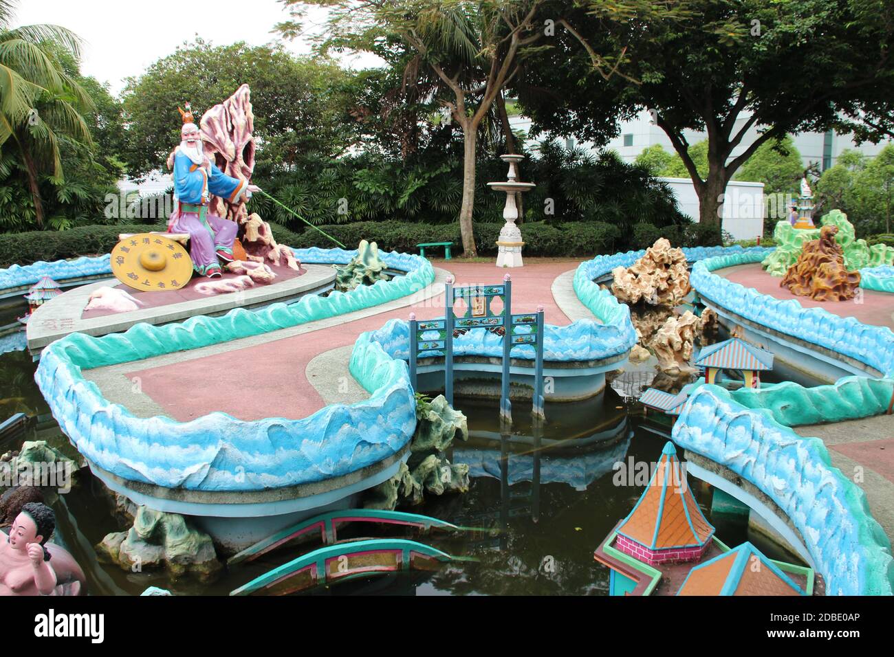 pond and statues at haw par villa in singapore Stock Photo Alamy