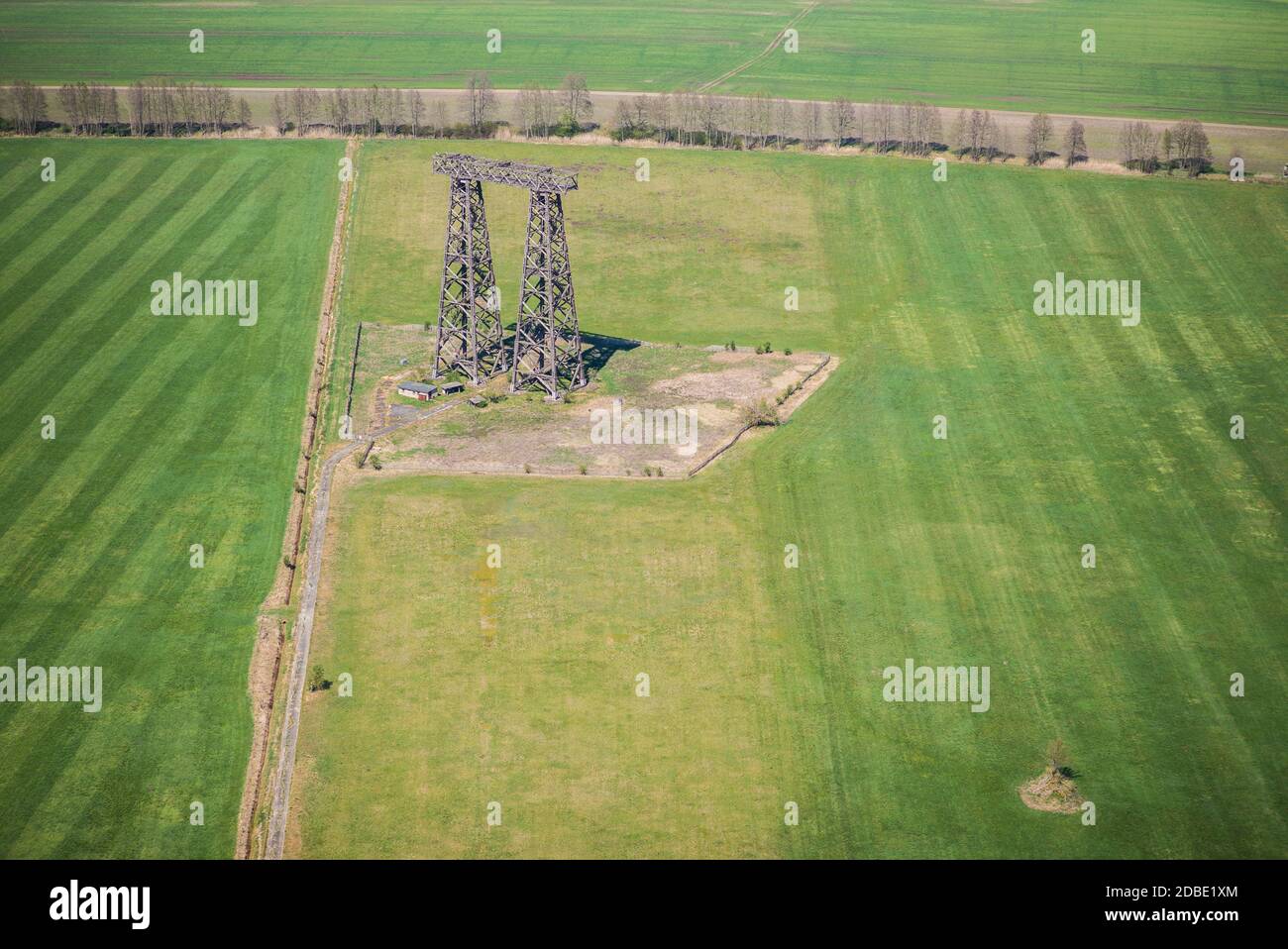 Broadcasting tower in wooden construction on a meadow near Brueck in Germany - historical monument - aerial view Stock Photo