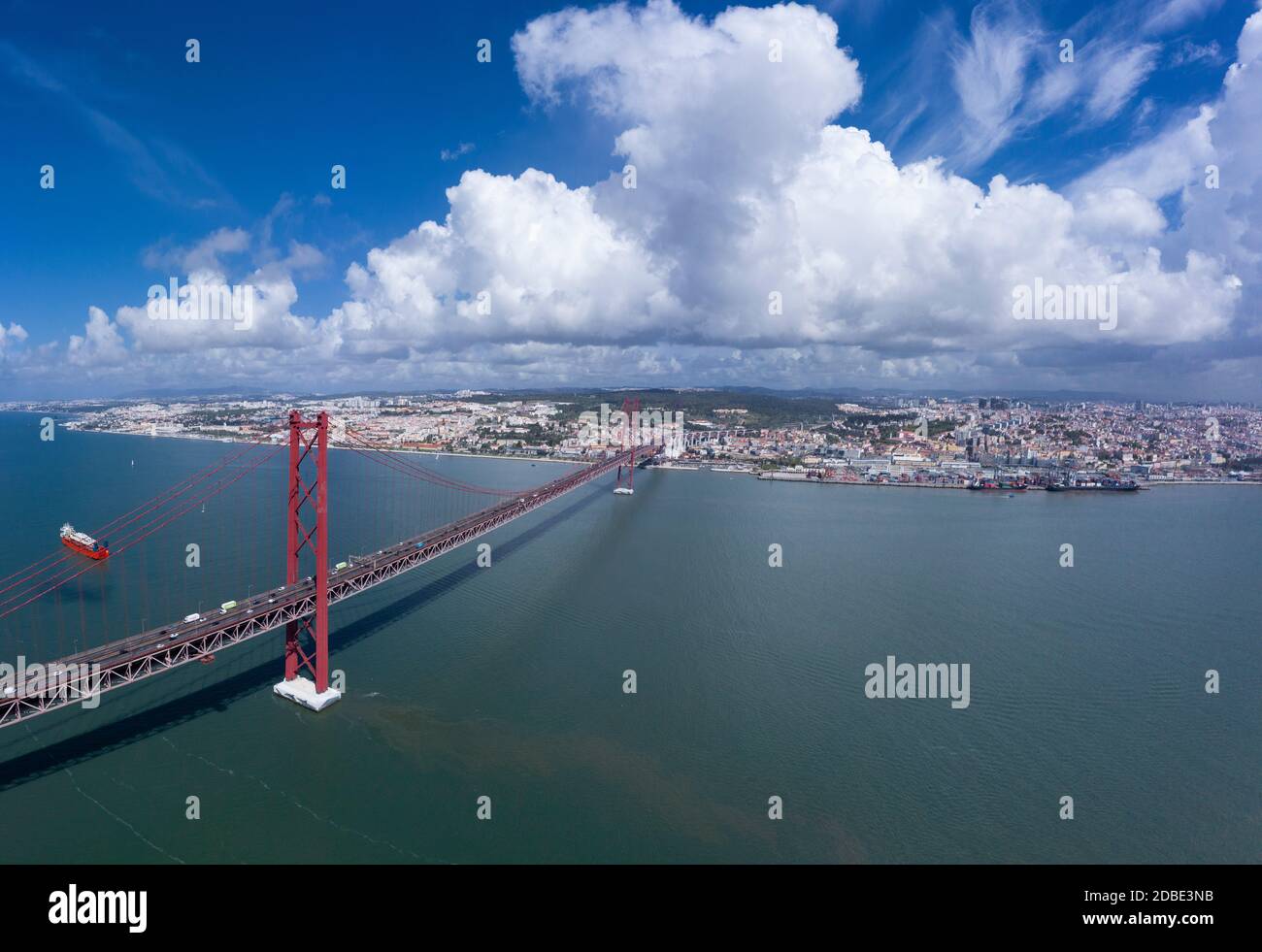 red bridge 25 april over river tagus sunny day cloud drone city landscape Stock Photo