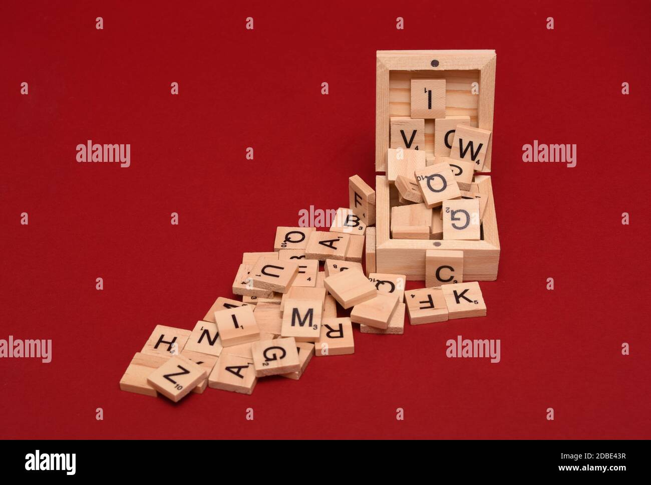 wooden tile letters spilling out of a box Stock Photo