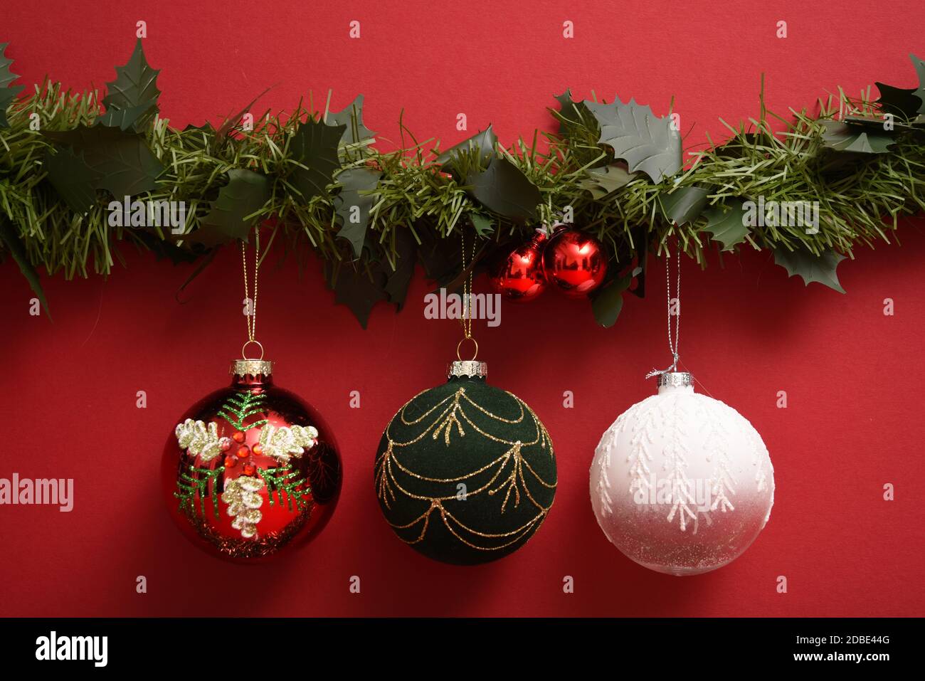 Christmas Baubles hanging on a garland Stock Photo