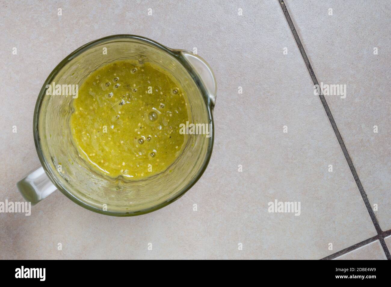 Making Mexican green tomatillo and chili salsa, Mexican food