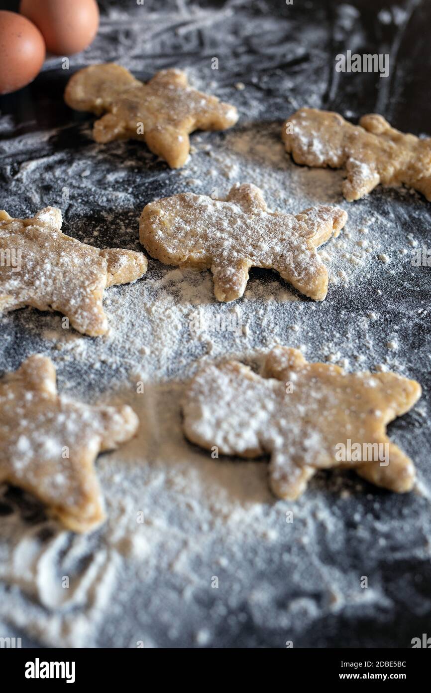 Person baking Gingerbread man cookies, Person hands in dough with ...