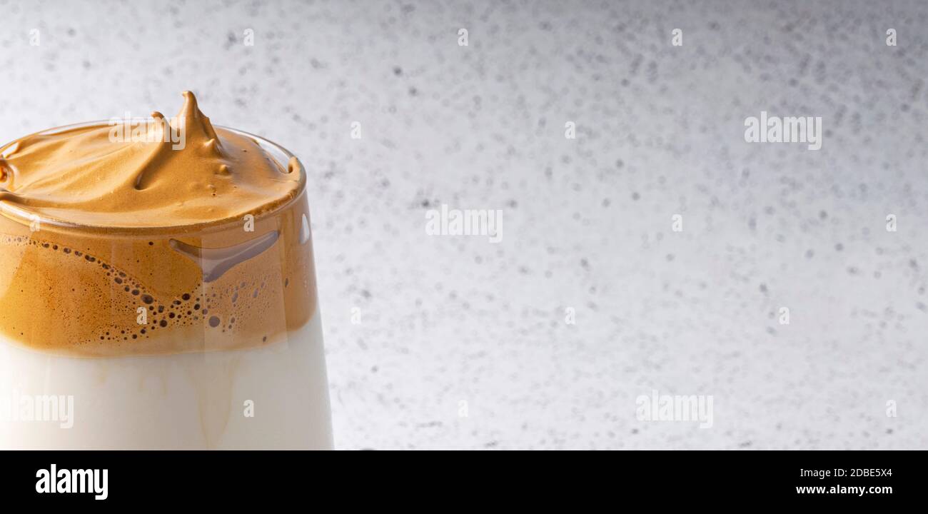 selective focus, Korean drink, dalgona coffee. with cold milk, sweet strong foam with sugar, banner Stock Photo