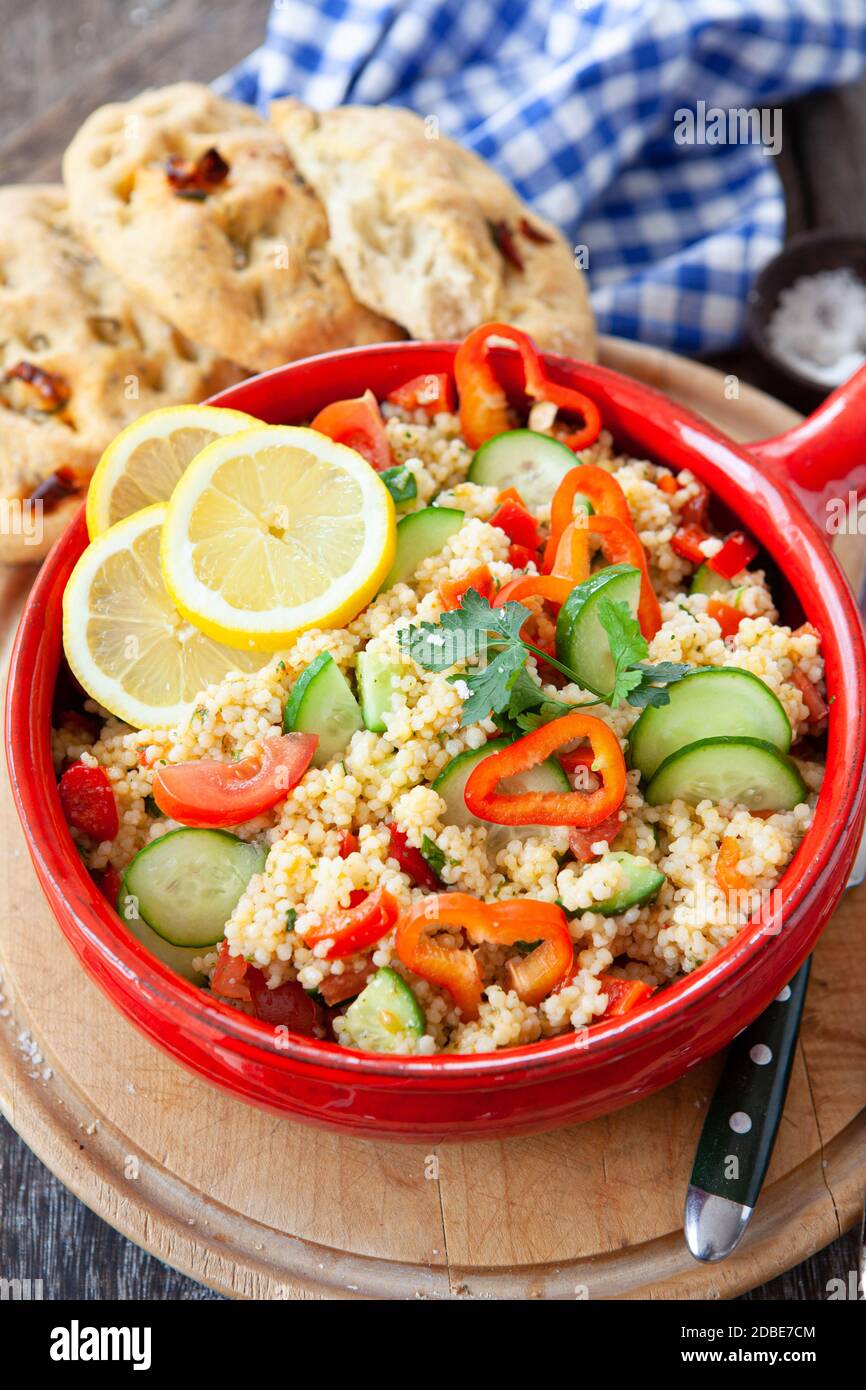 Homemade Ptitim / Israeli Couscous salad with fresh herbs Stock Photo