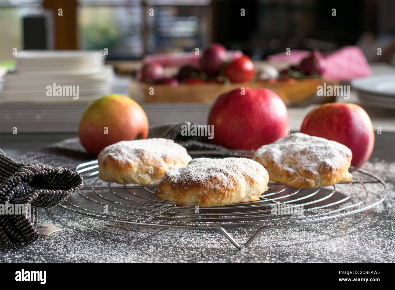 Pastry pieces on a cooling grid. Apple pie pockets Stock Photo