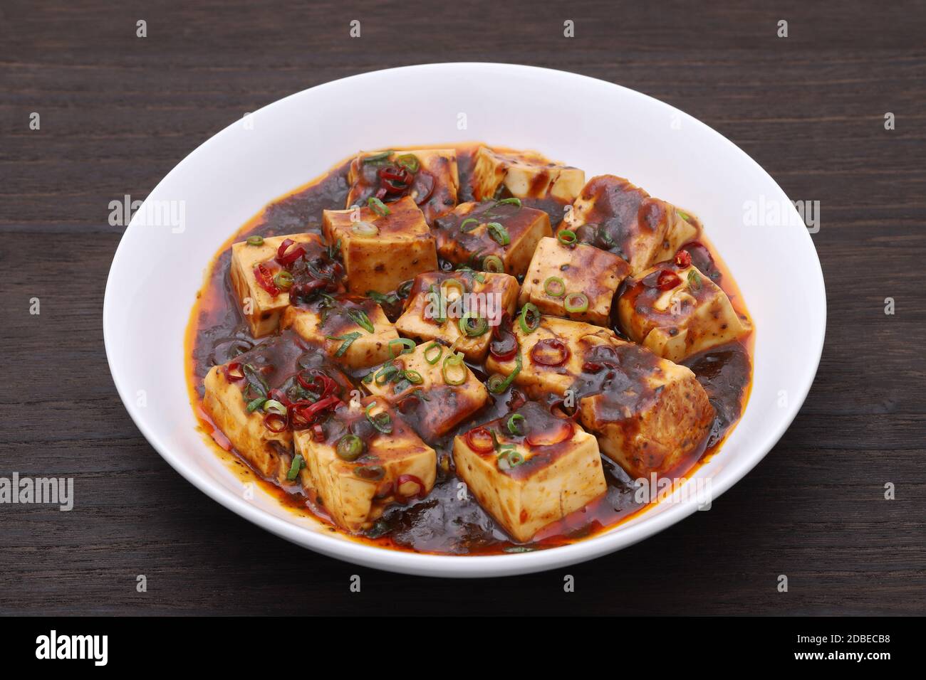 Chinese cuisine mabo tofu in a dish on wooden table Stock Photo