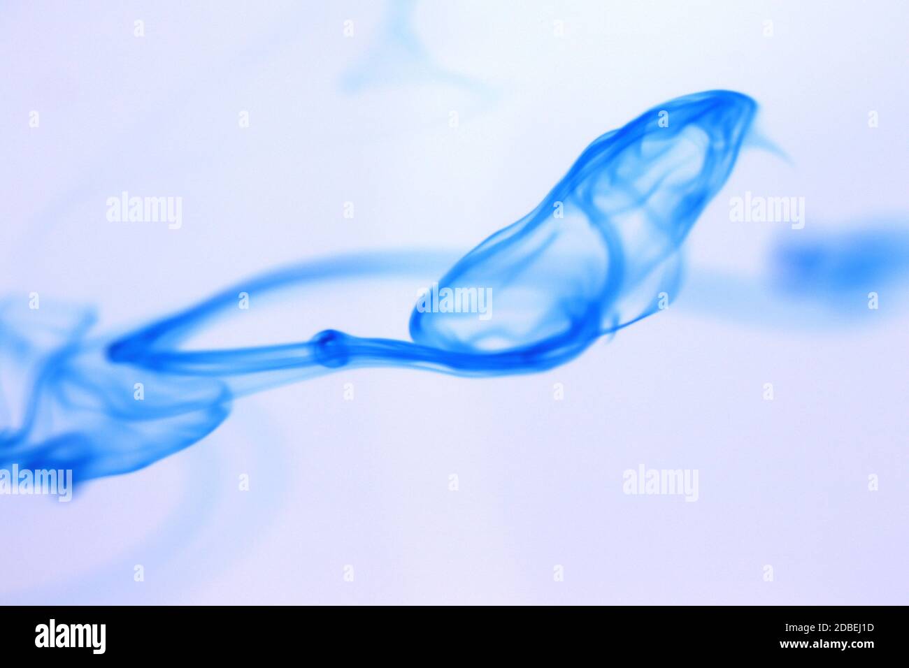 Ink Drop Mystic Magic Dynamic Motion in Water. Soft Background. Stock Photo