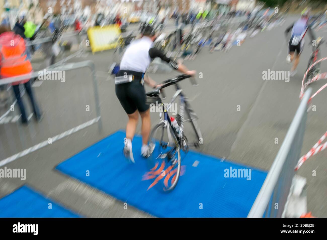 Competitors entering the transition area after the bike ride in