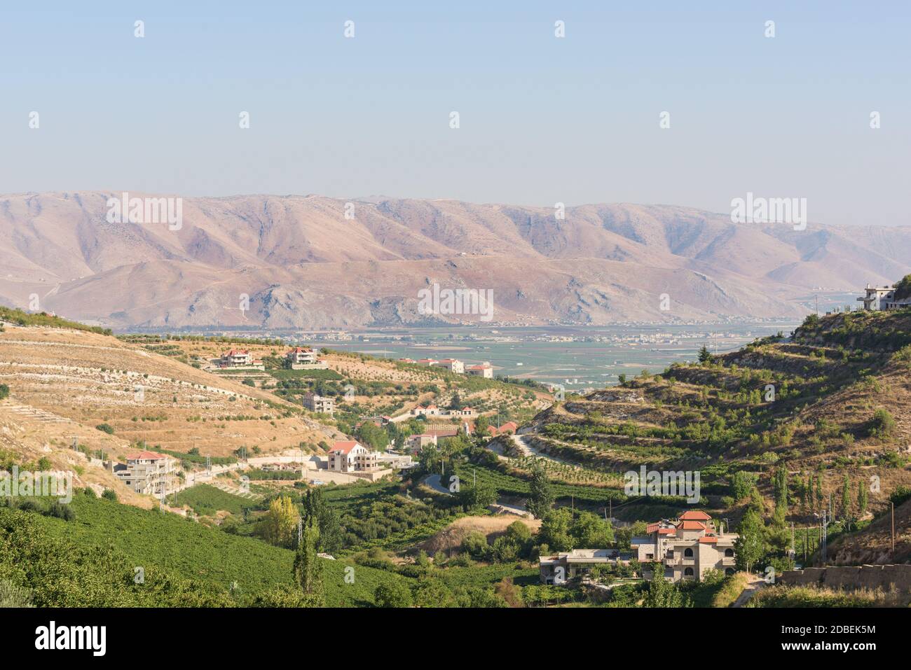 Panorama of the Bekaa Valley landscape over Fourzol, with ancient Roman temple of Niha and Anti-Lebanon mountains, in Zahle, Lebanon Stock Photo