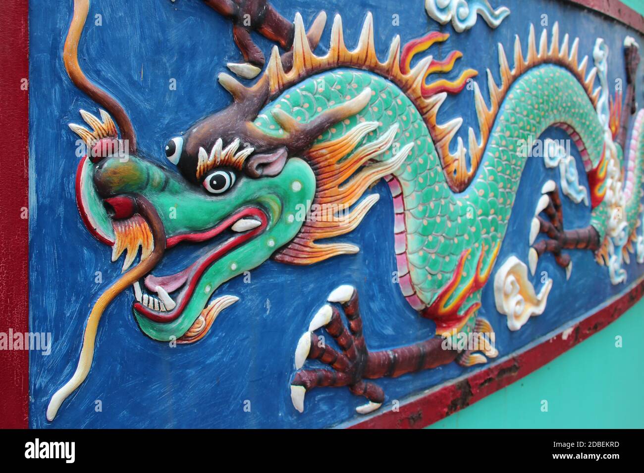 sculpted dragon on a wall at haw par villa in singapore Stock Photo Alamy