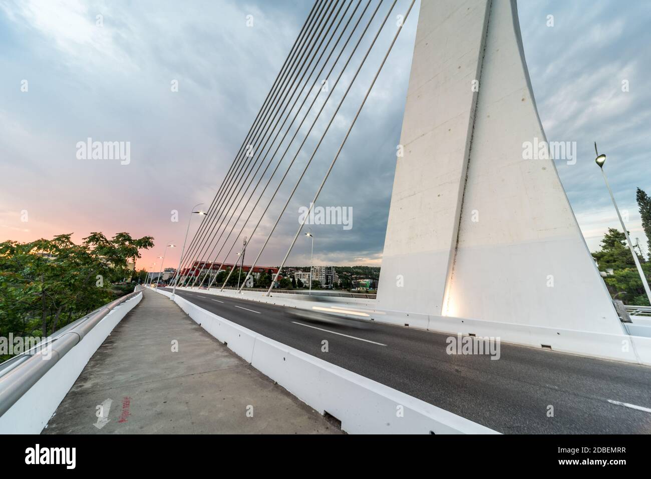 The impressive modern design featuring twelve cables which support the roadway deck, while twenty-four more are attached to counterweights. creating a Stock Photo