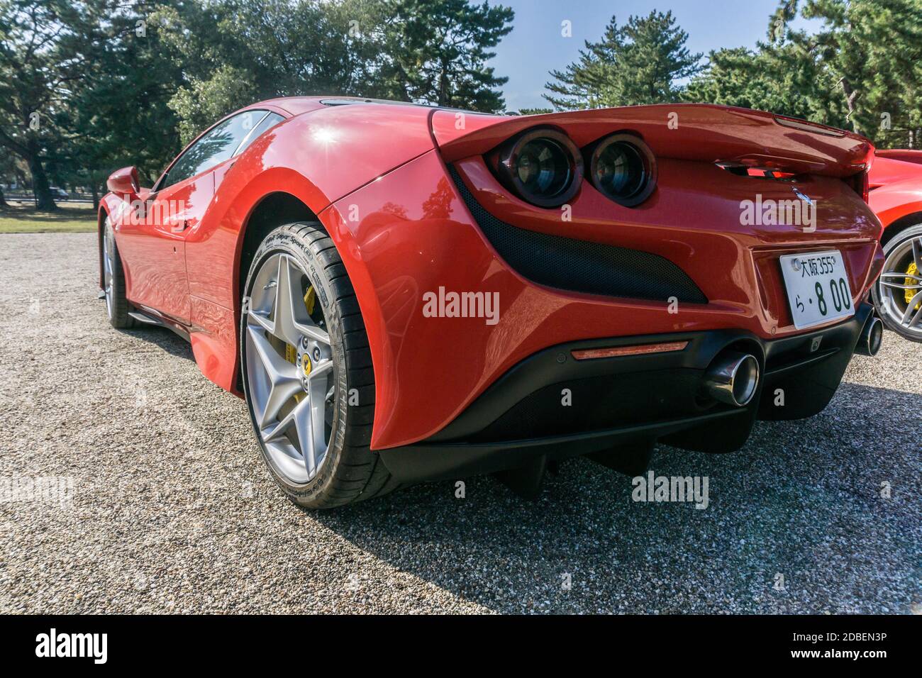 Rear view of a rosso red Ferrari F8 Tributo in the autumn sunshine in Nara, Japan Stock Photo