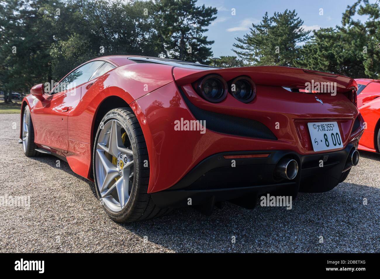 Rear view of a rosso red Ferrari F8 Tributo in the autumn sunshine in Nara, Japan Stock Photo