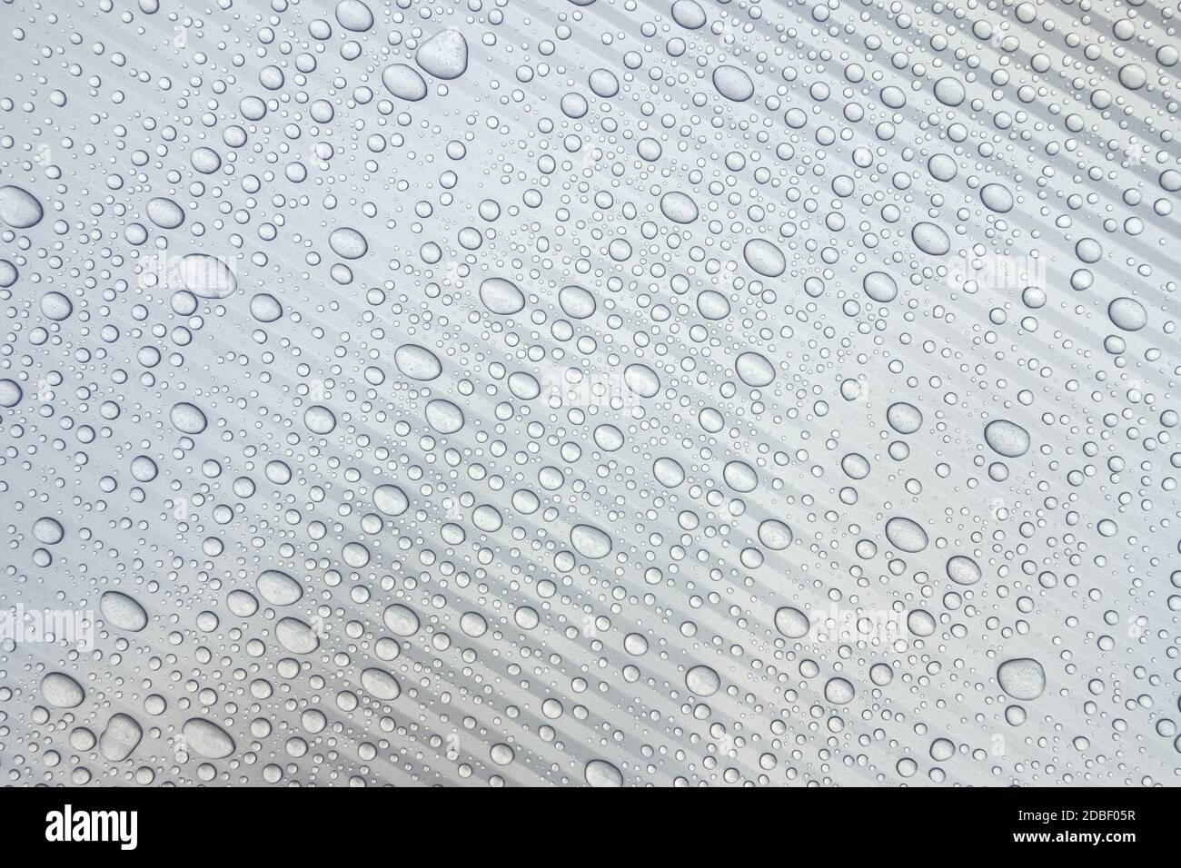 Light gray plastic surface with drops of water Stock Photo