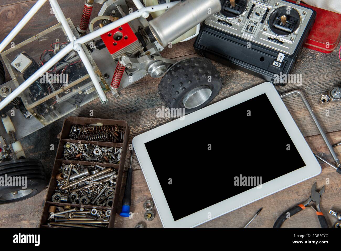 a computer tablet with RC radio control car and tools Stock Photo - Alamy