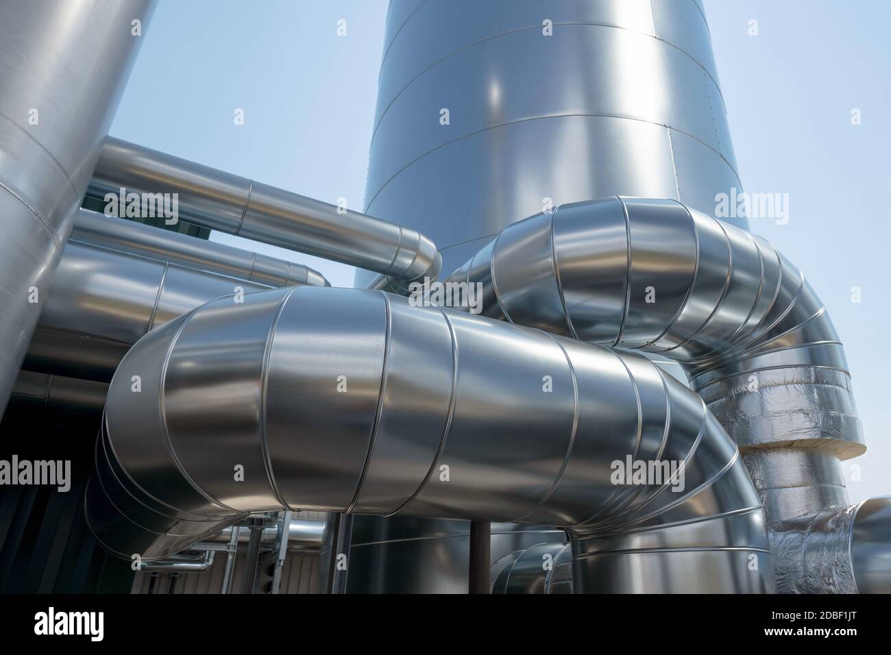 Detail of a new industrial plant with pipes and silo Stock Photo