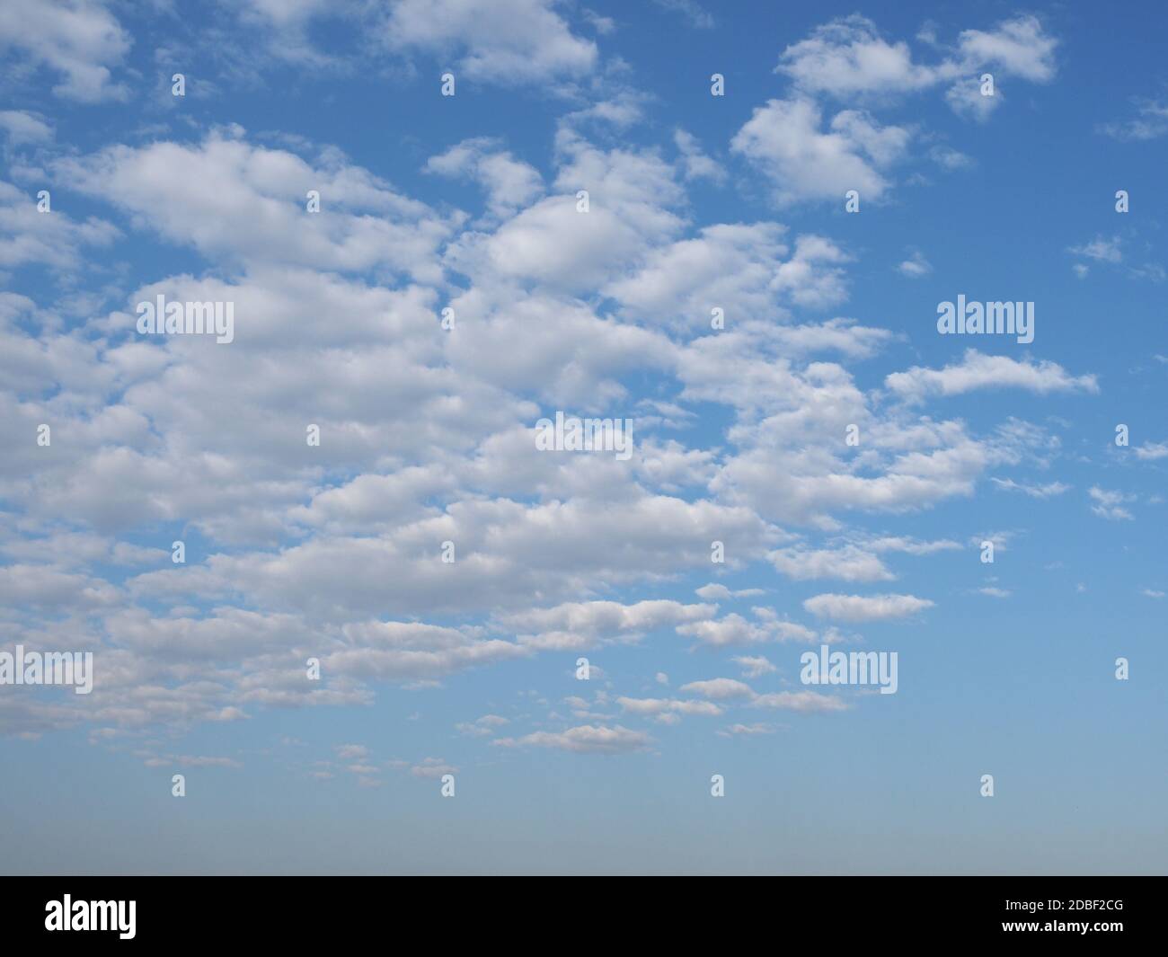 blue sky with clouds useful as a background Stock Photo - Alamy