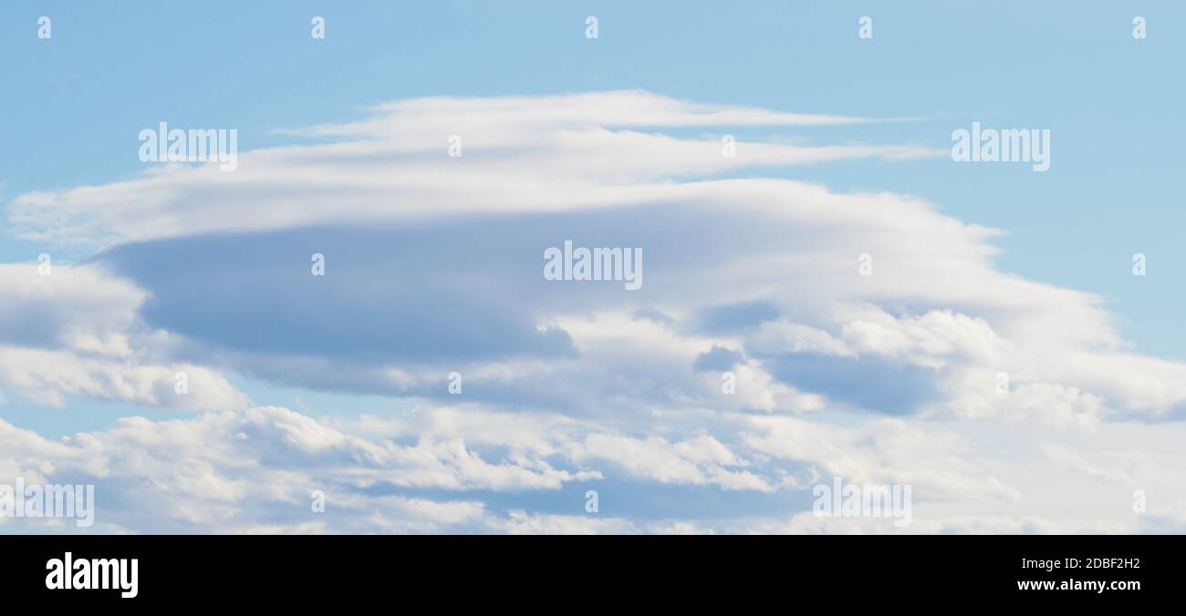 blue sky with clouds useful as a background Stock Photo - Alamy