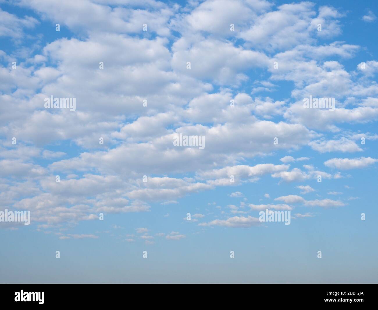 blue sky with clouds useful as a background Stock Photo - Alamy