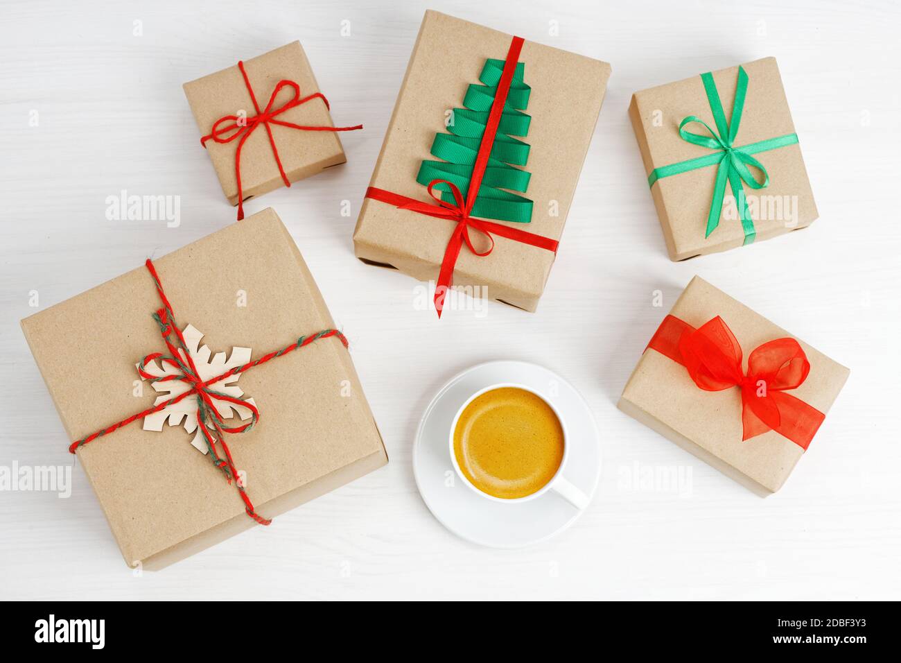 Group of gift boxes wrapped in kraft paper, tied with twine and ...