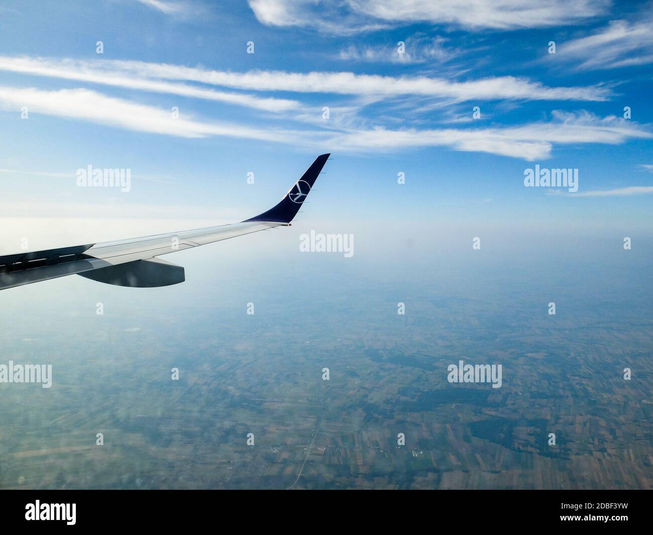 LOT Airlines B737-800 flight from London Heathrow to Warsaw,Poland as viewed from right hand passenger cabin window on a morning flight. Stock Photo