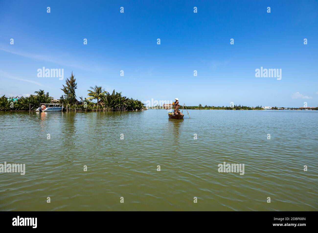 Traditional Fisherman is fishing in Hoi An Vietnam Stock Photo