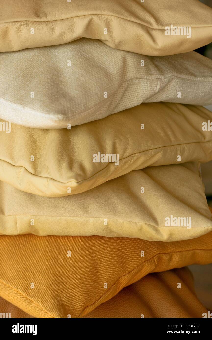 Beige decorative pillows made from real leather Stock Photo