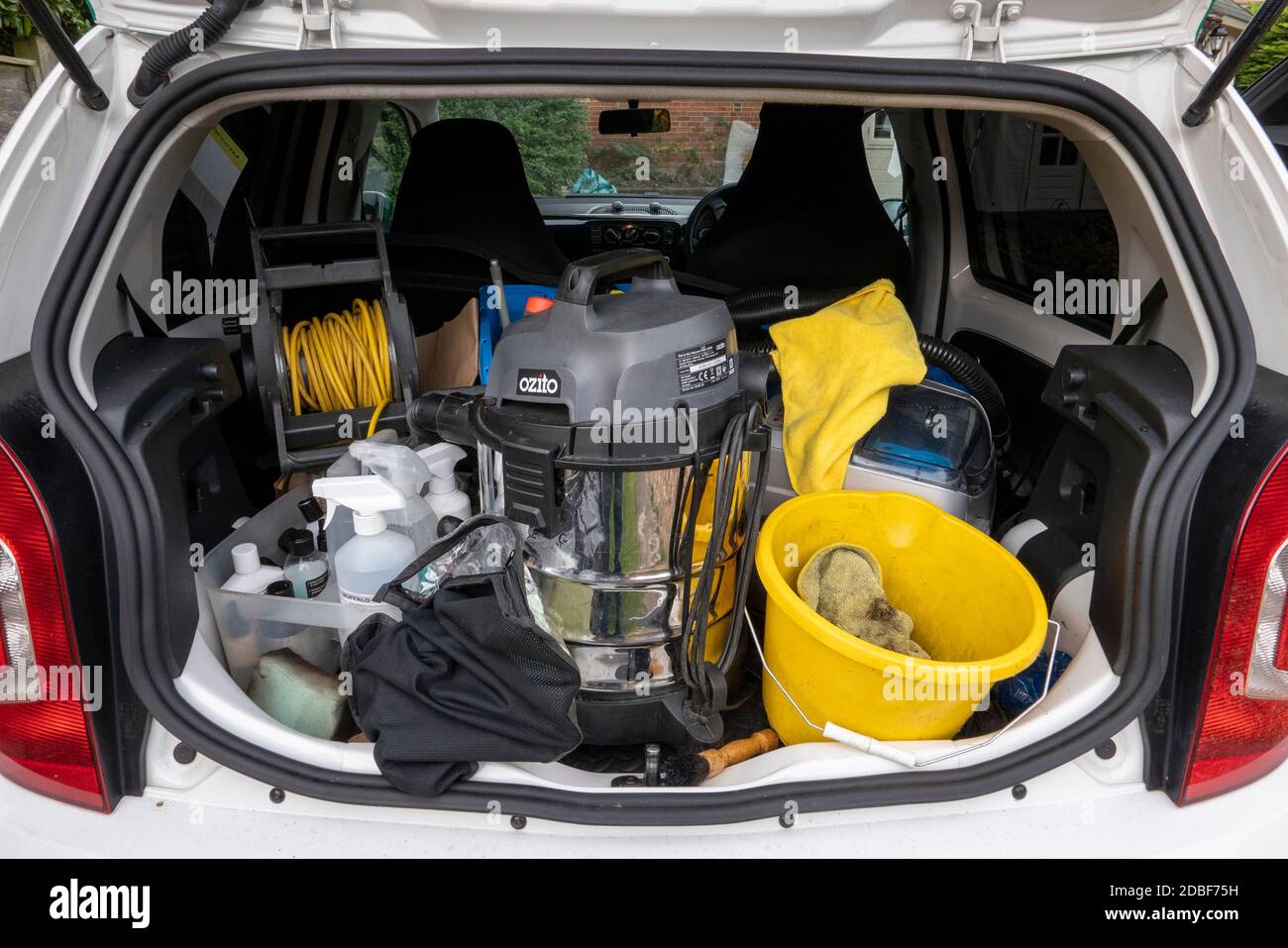 England, UK. 2020. Boot of a small van containing materials used to operate a car cleaning business Stock Photo