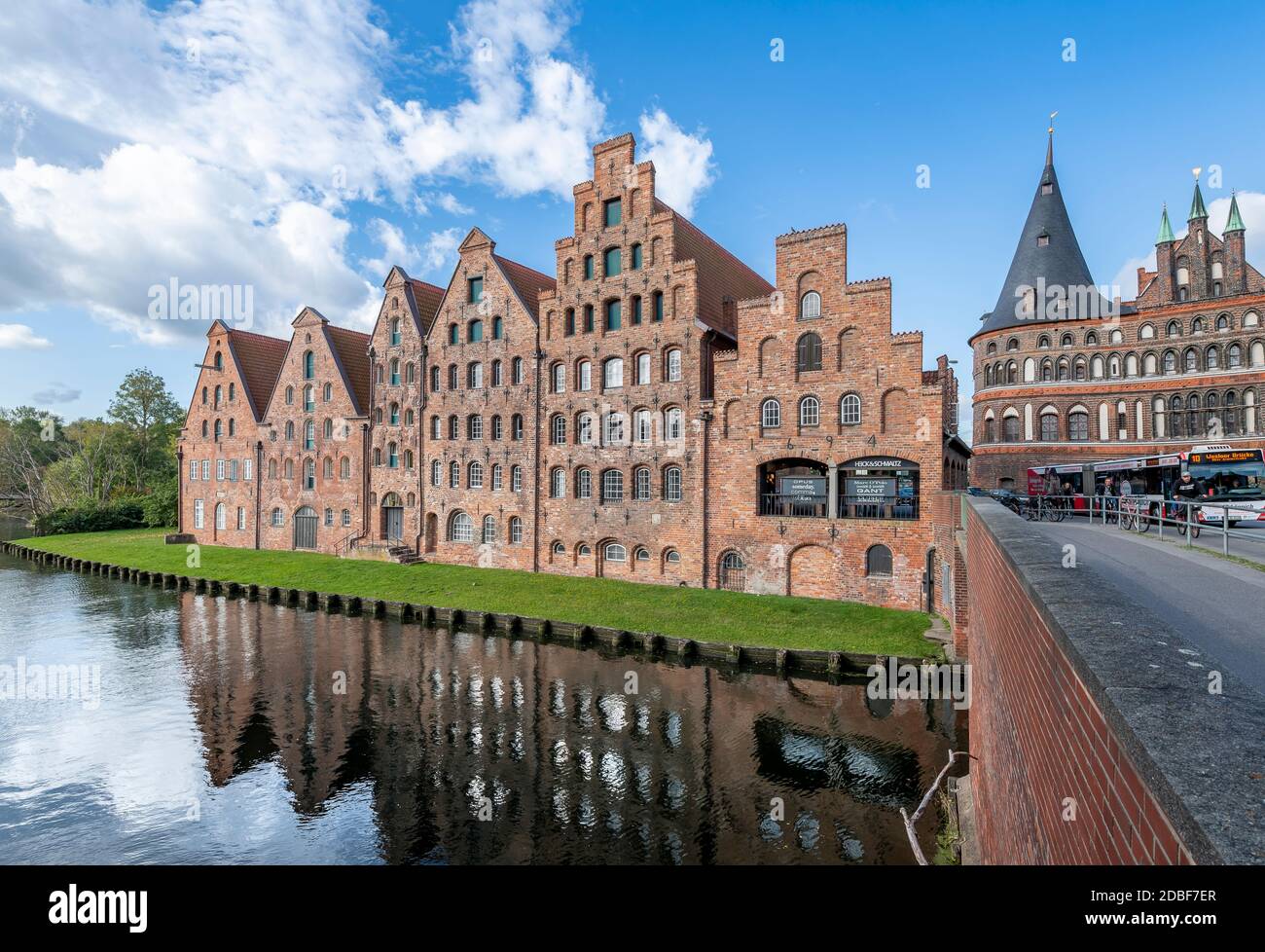 The Salzspeicher (salt storehouses), in Lübeck, northern Germany. Six historic brick buildings on the Upper Trave River next to the Holstentor. Stock Photo