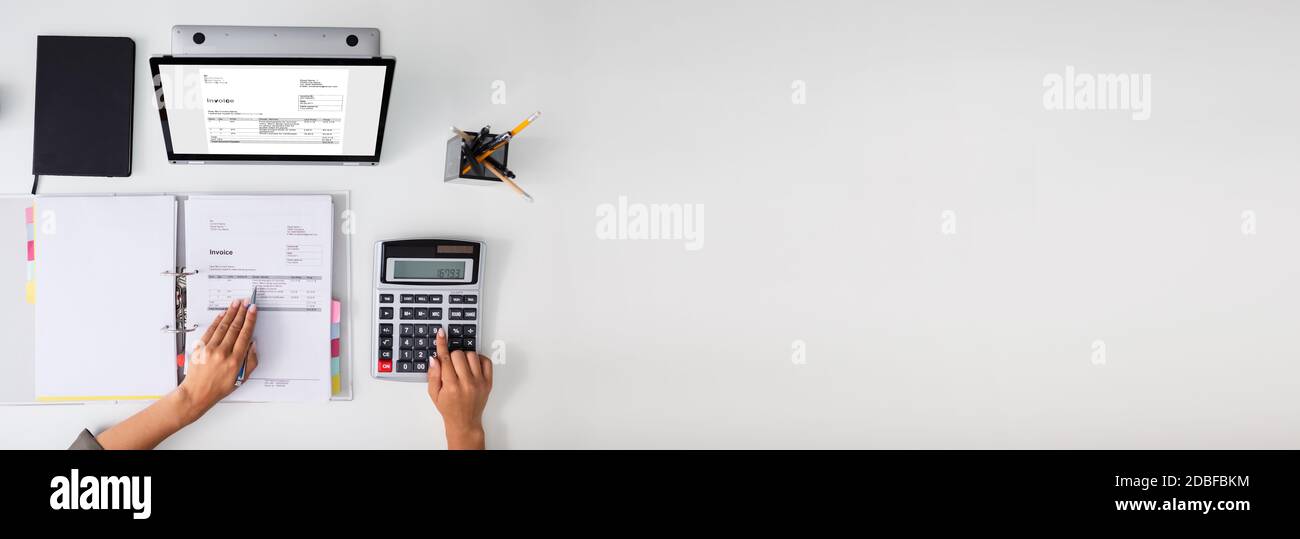 Professional Chartered Accountant Using Invoice Software For Tax Stock