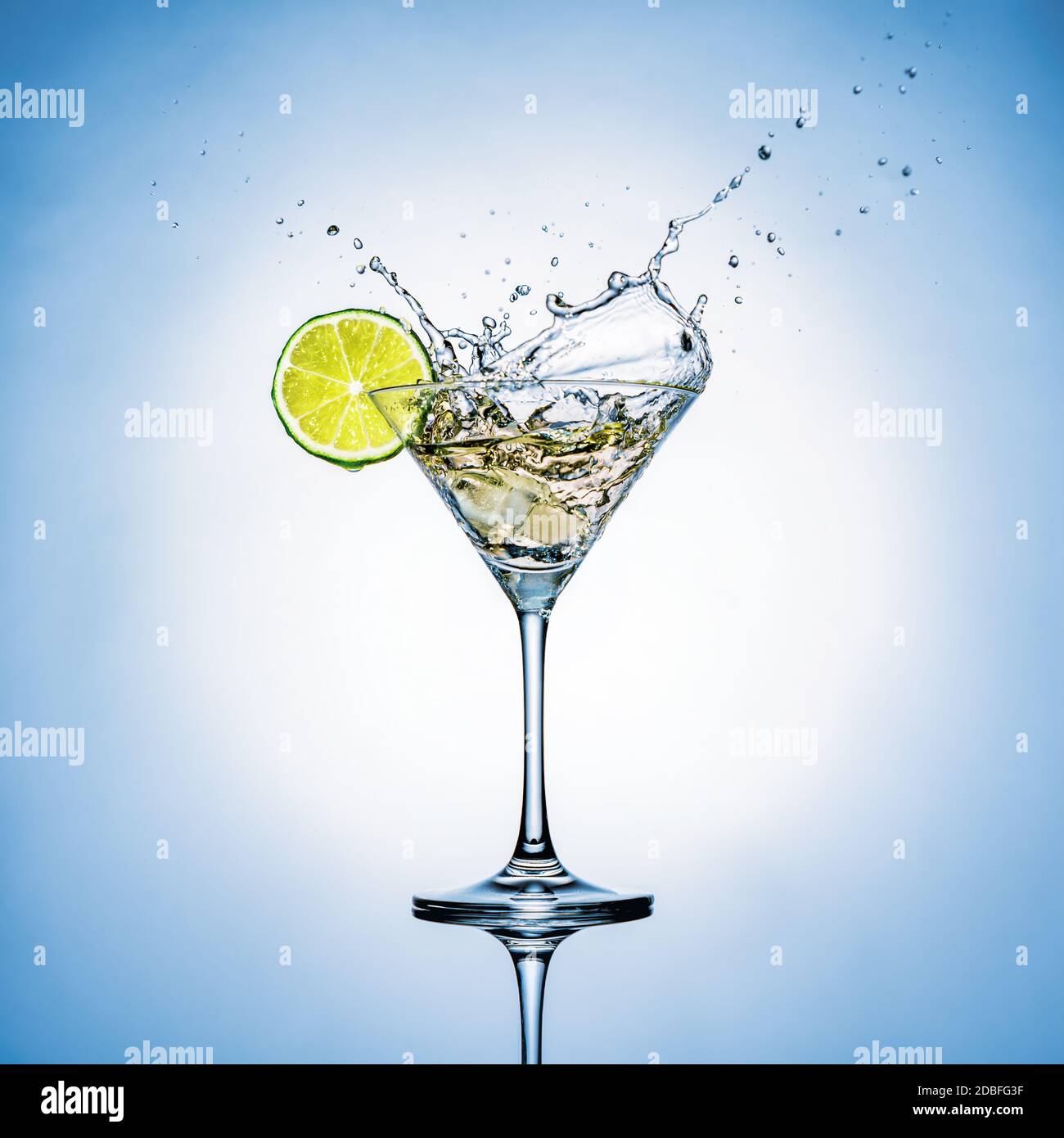 cocktail glass with lime and splashes Stock Photo