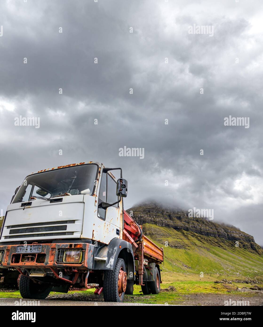 Old ruined truck abandoned near the mountains Stock Photo