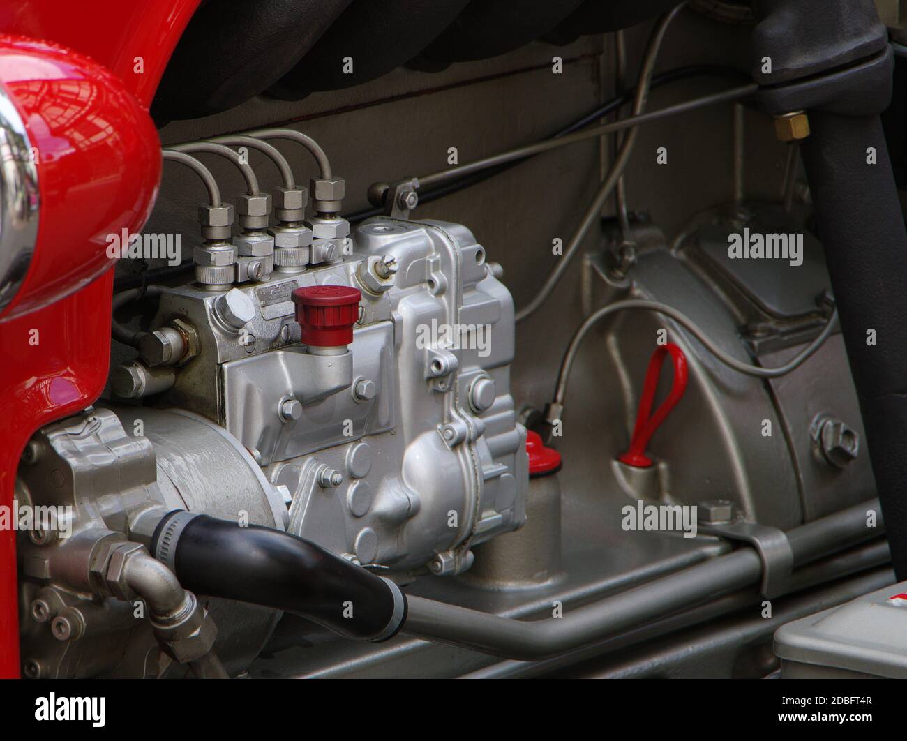 Silvery engine block in red tractor classic car Stock Photo