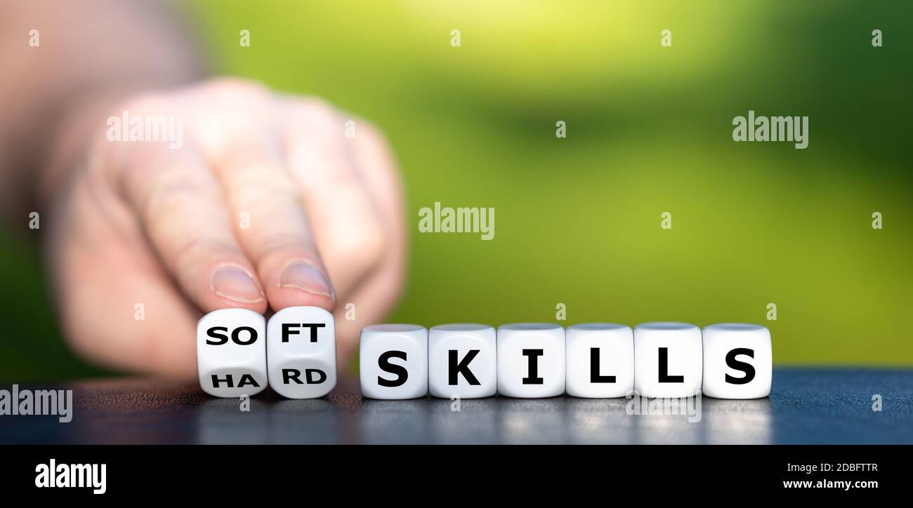 Hard skills versus soft skills. Dice form the expressions 'hard skills' and 'soft skills'. Stock Photo