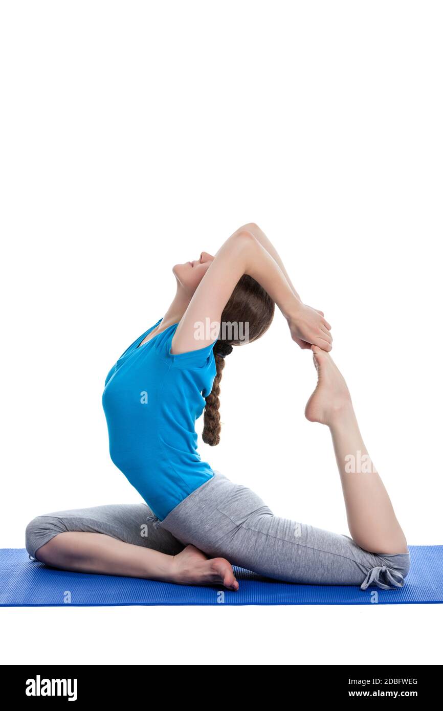Yoga - young beautiful woman  yoga instructor doing King Pigeon Pose (Raja Kapotasana) exercise  isolated on white background Stock Photo