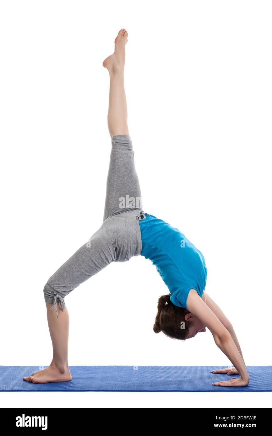 Yoga - young beautiful woman  yoga instructor doing Wheel Pose with one leg lifted straight up (Eka Pada Chakrasana) exercise isolated on white backgr Stock Photo