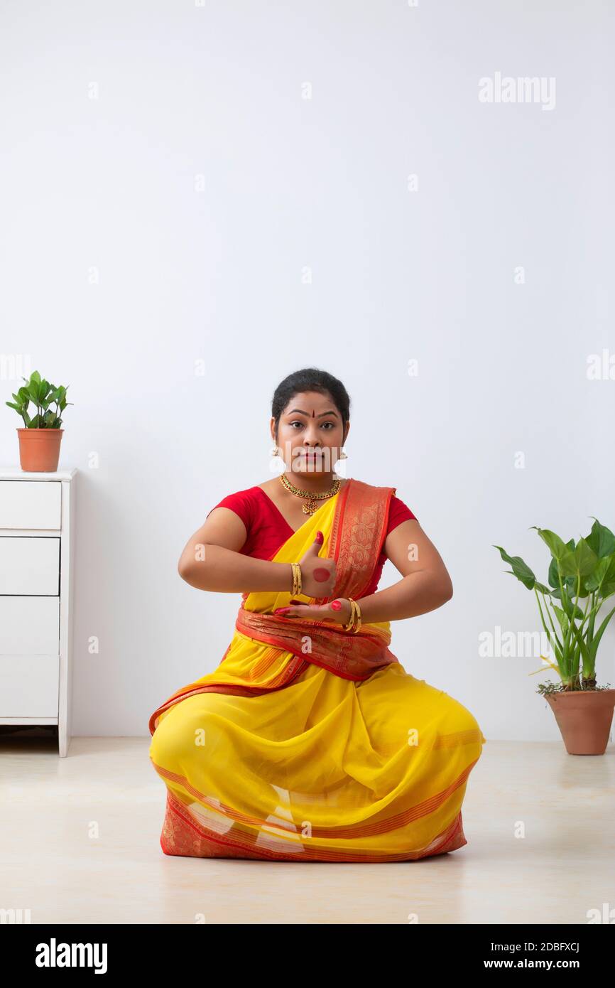 Kuchipudi dancer depicting Shivlingam through dance posture Stock Photo