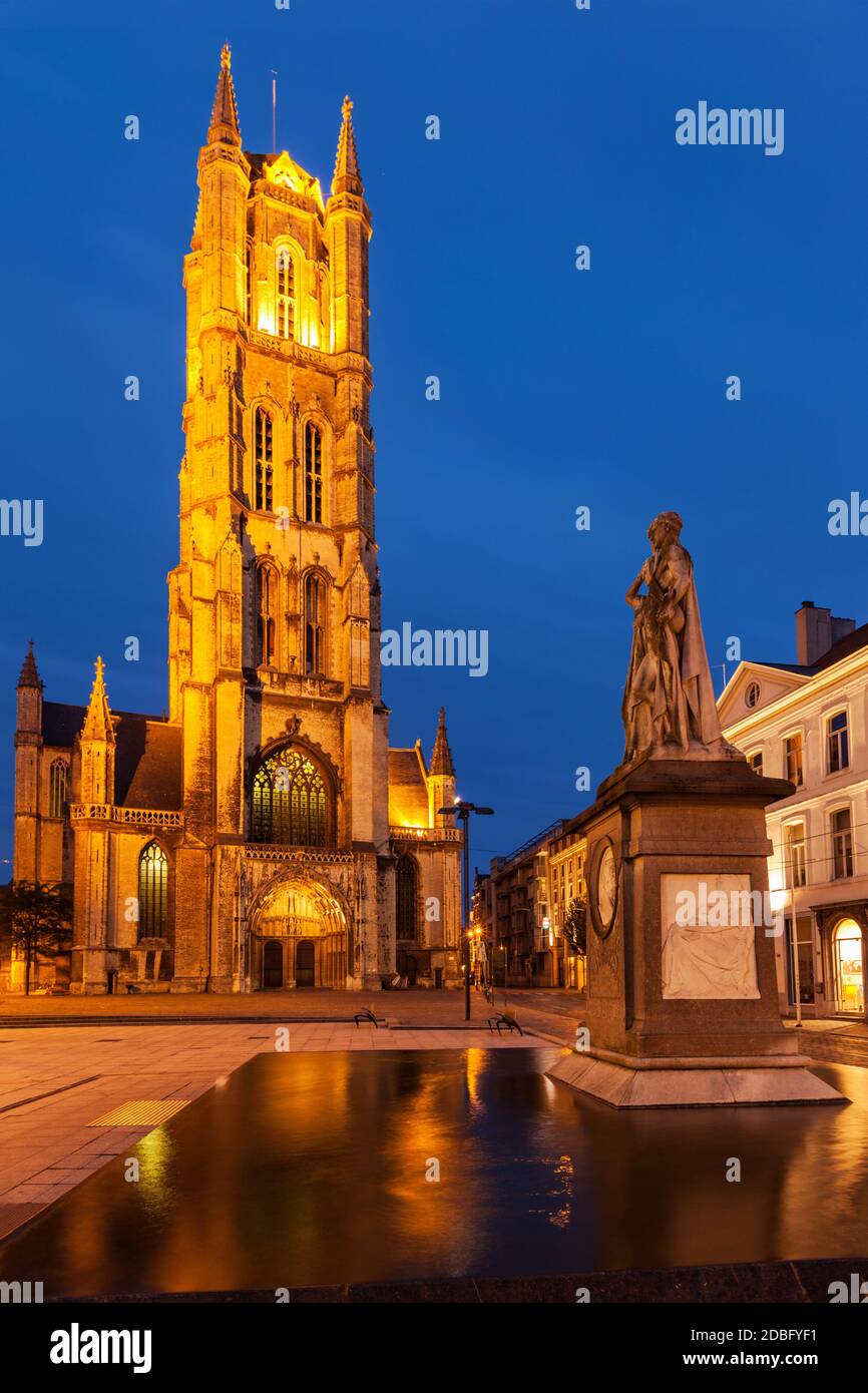 Monument to Jan Frans Willems and Saint Bavo Cathedral in the evening. Sint-Baafsplein, Flanders, Ghent, Belgium Stock Photo