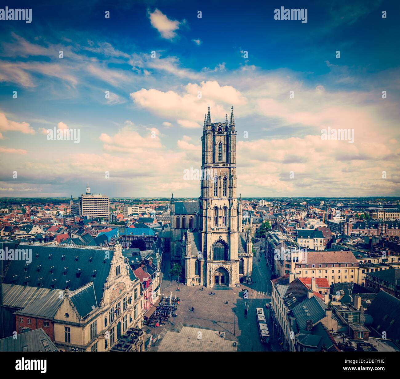 Vintage retro hipster style travel image of Saint Bavo Cathedral (Sint-Baafskathedraal) and Sint-Baafsplein, view from Belfry. Ghent, Belgium Stock Photo