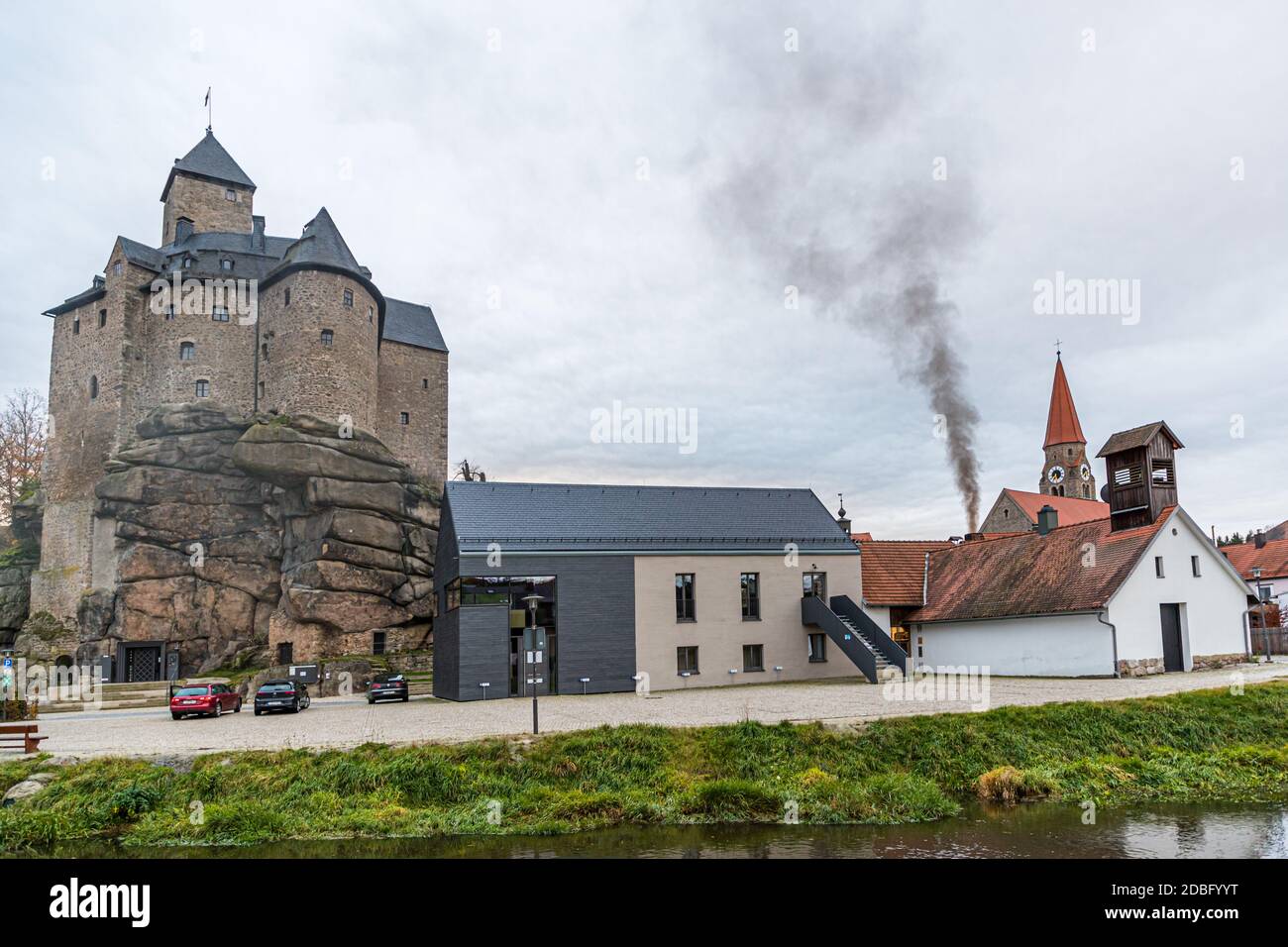 Black smoke rises above the Traditional Community Zoigl Brewery in Falkenberg, Germany Stock Photo