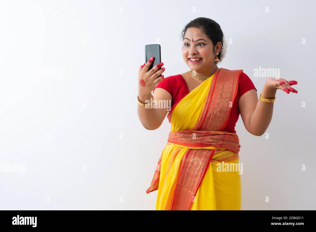 Kuchipudi dancer talking to her friends on videocall Stock Photo