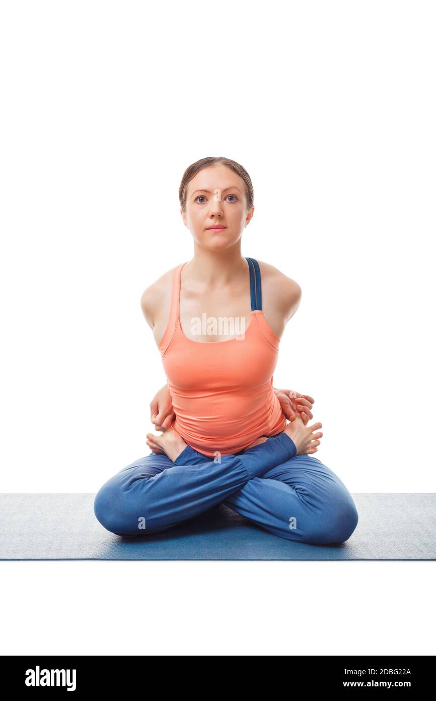 Sporty fit woman doing Ashtanga Vinyasa yoga asana Baddha Padmasana