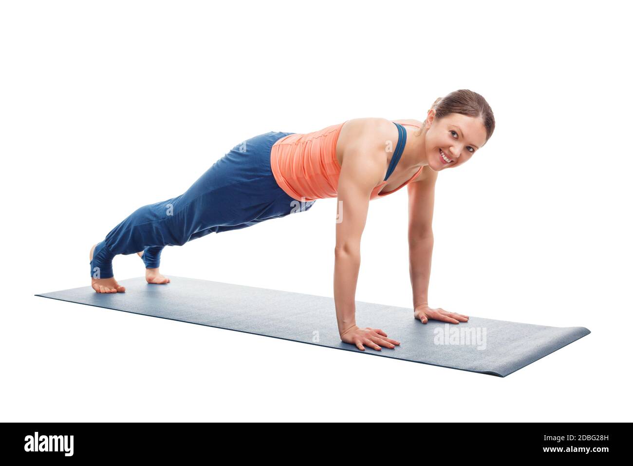 Smiling woman doing Ashtanga Vinyasa yoga asana Utthita chaturanga